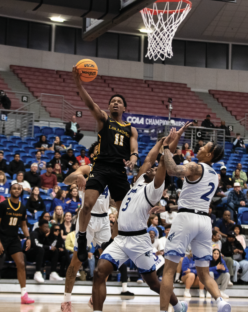 Foward Corey Cofield goes for the right handed layup against Cal State San Bernardino defenders on Saturday March 9 at Cal State San Bernardino. Cal State LA won 73-62 to win the CCAA tournament. Caption by Sasha Funes.